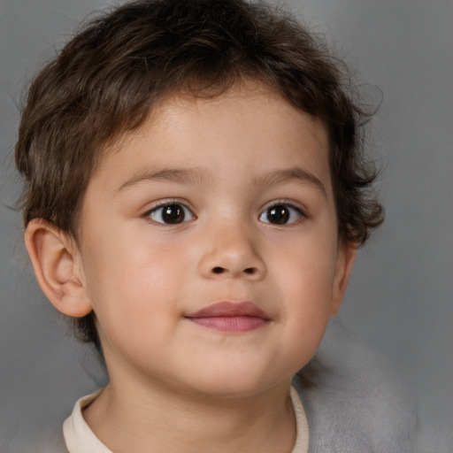 Joyful white child male with short  brown hair and brown eyes