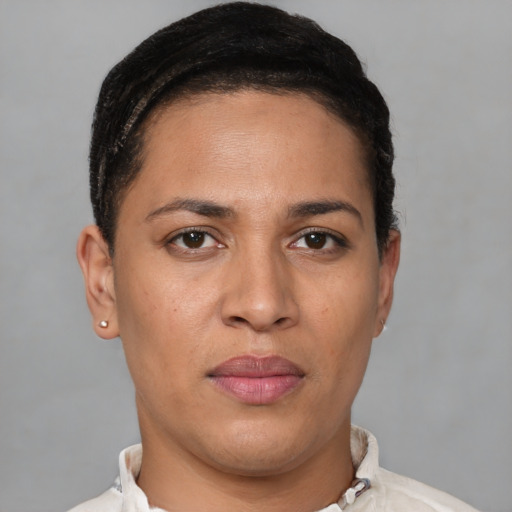 Joyful white young-adult female with short  brown hair and brown eyes
