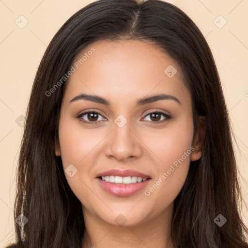 Joyful white young-adult female with long  brown hair and brown eyes