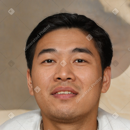 Joyful asian young-adult male with short  brown hair and brown eyes