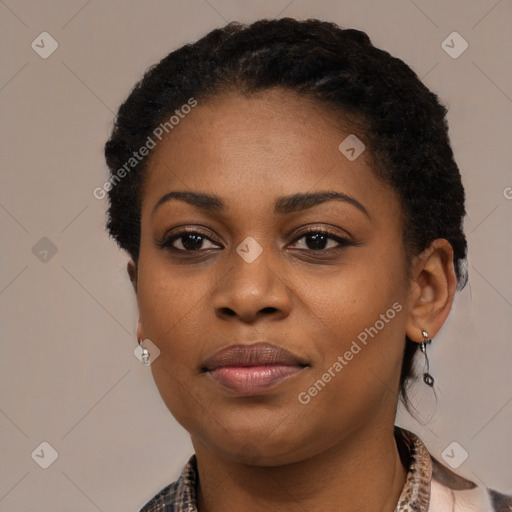 Joyful black young-adult female with short  black hair and brown eyes