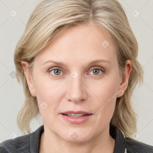 Joyful white young-adult female with medium  blond hair and blue eyes