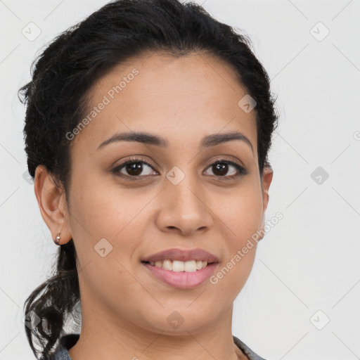 Joyful latino young-adult female with long  brown hair and brown eyes