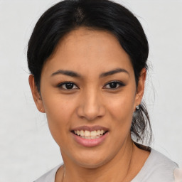 Joyful asian young-adult female with medium  black hair and brown eyes