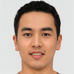 Joyful asian young-adult male with short  black hair and brown eyes