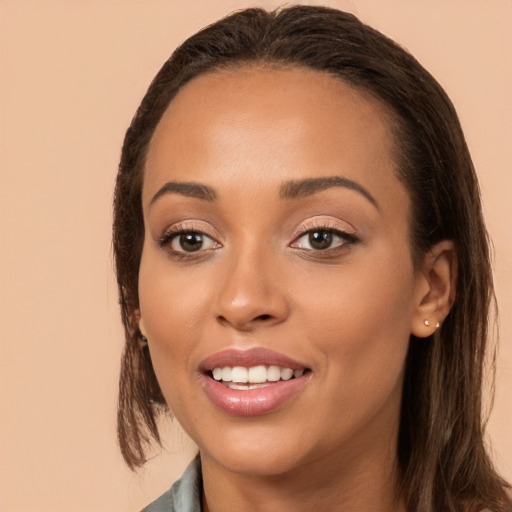 Joyful white young-adult female with long  brown hair and brown eyes