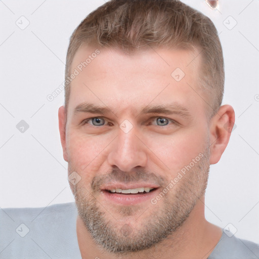 Joyful white young-adult male with short  brown hair and brown eyes