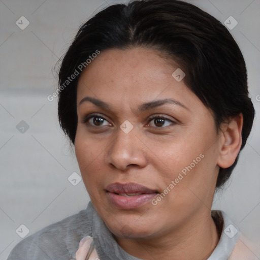 Joyful white adult female with short  brown hair and brown eyes