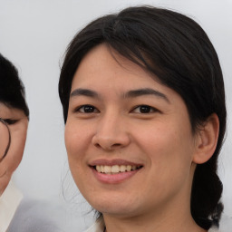 Joyful asian young-adult female with medium  black hair and brown eyes