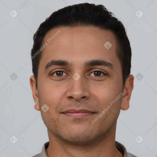 Joyful white young-adult male with short  black hair and brown eyes