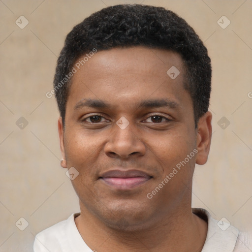 Joyful black young-adult male with short  black hair and brown eyes