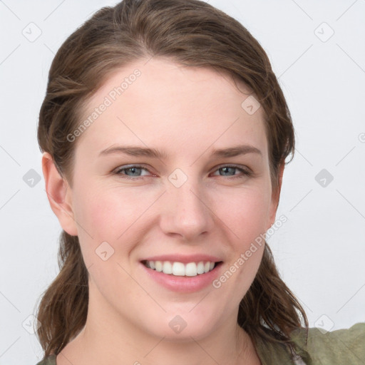 Joyful white young-adult female with long  brown hair and grey eyes