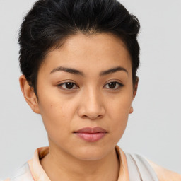 Joyful asian young-adult female with short  brown hair and brown eyes