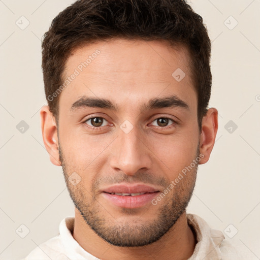 Joyful white young-adult male with short  brown hair and brown eyes