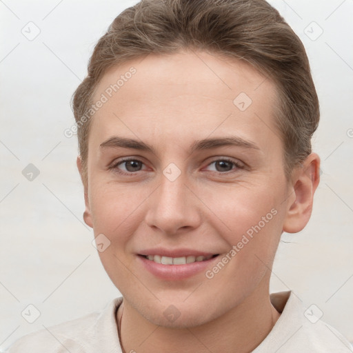 Joyful white young-adult female with short  brown hair and brown eyes