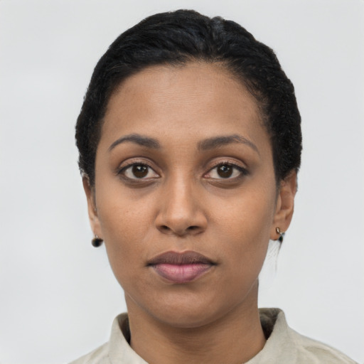 Neutral latino young-adult female with short  black hair and brown eyes