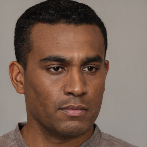 Neutral black young-adult male with short  brown hair and brown eyes