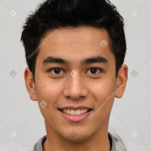 Joyful latino young-adult male with short  brown hair and brown eyes