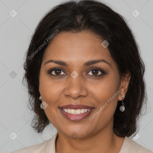 Joyful black adult female with medium  brown hair and brown eyes