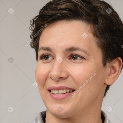 Joyful white adult female with short  brown hair and brown eyes