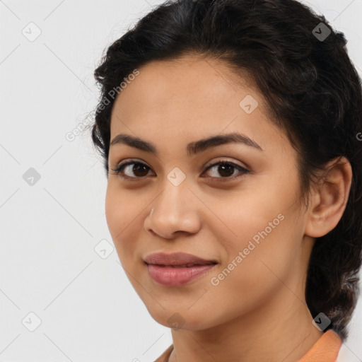 Joyful latino young-adult female with medium  brown hair and brown eyes