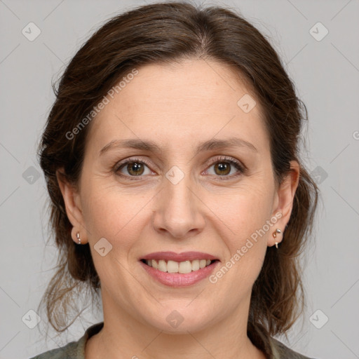 Joyful white young-adult female with medium  brown hair and green eyes