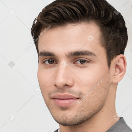 Neutral white young-adult male with short  brown hair and brown eyes