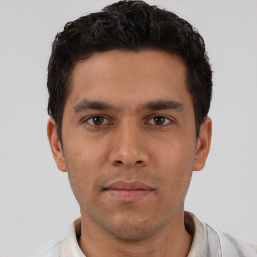 Neutral latino young-adult male with short  brown hair and brown eyes