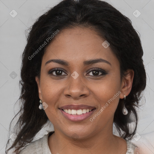 Joyful black young-adult female with long  brown hair and brown eyes