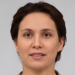 Joyful white adult female with short  brown hair and brown eyes