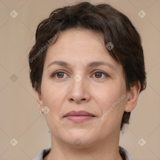 Joyful white adult female with short  brown hair and brown eyes