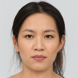 Joyful asian young-adult female with medium  brown hair and brown eyes