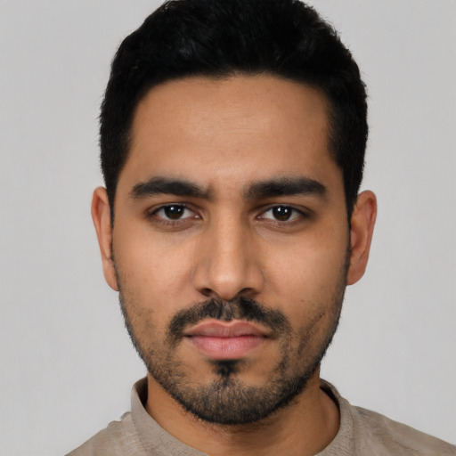 Neutral latino young-adult male with short  black hair and brown eyes