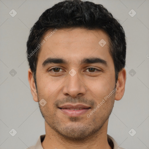 Joyful latino young-adult male with short  black hair and brown eyes