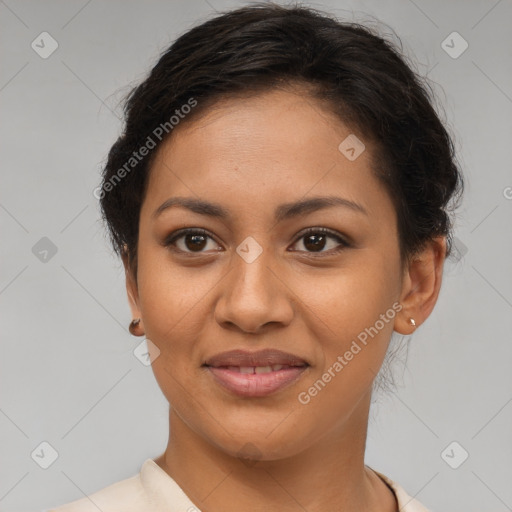 Joyful latino young-adult female with short  brown hair and brown eyes