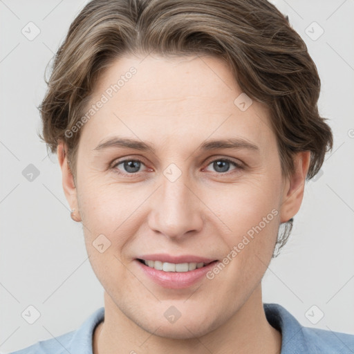 Joyful white young-adult female with short  brown hair and grey eyes