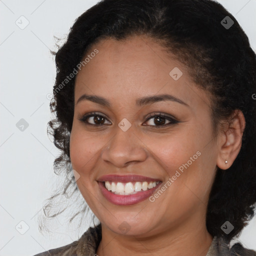 Joyful latino young-adult female with medium  brown hair and brown eyes