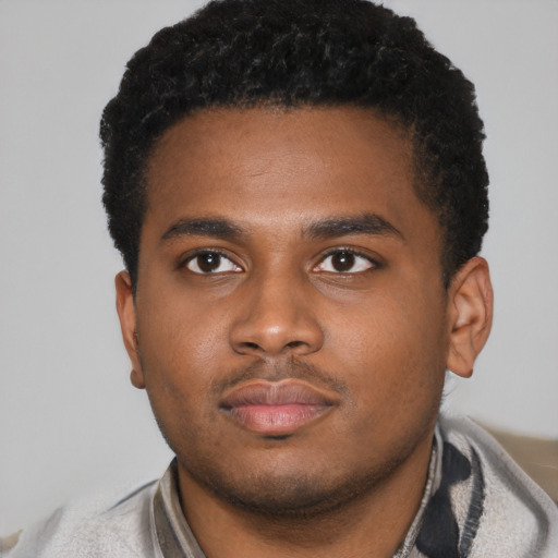 Neutral latino young-adult male with short  brown hair and brown eyes