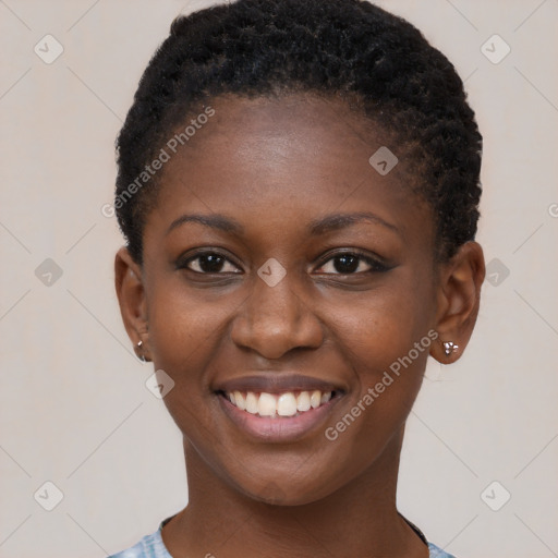 Joyful black young-adult female with short  brown hair and brown eyes