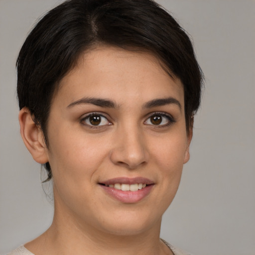 Joyful white young-adult female with short  brown hair and brown eyes