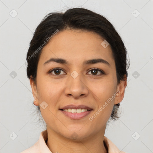 Joyful latino adult female with medium  brown hair and brown eyes