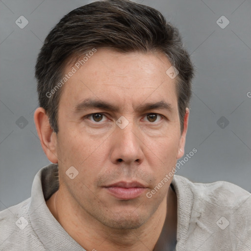 Neutral white adult male with short  brown hair and grey eyes