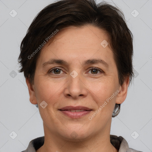 Joyful white adult female with short  brown hair and brown eyes