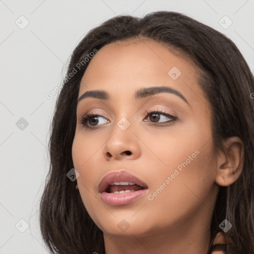 Joyful white young-adult female with long  brown hair and brown eyes