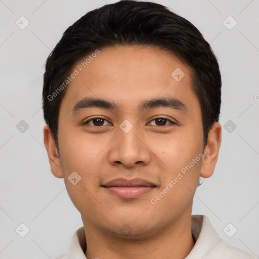 Joyful latino young-adult male with short  black hair and brown eyes