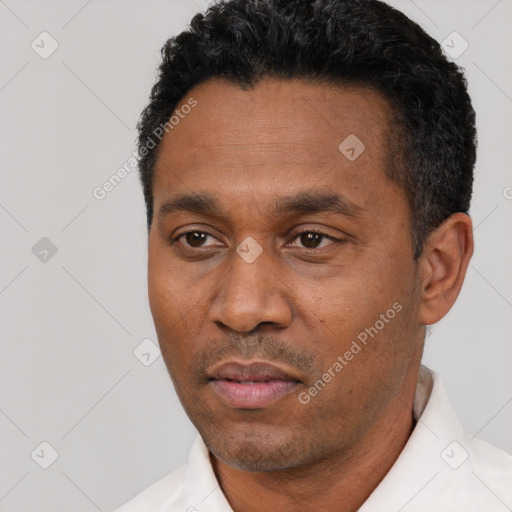 Neutral black adult male with short  black hair and brown eyes