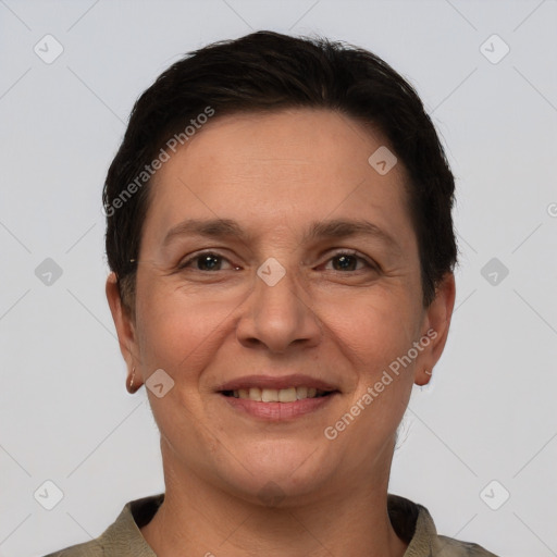 Joyful white adult female with short  brown hair and brown eyes