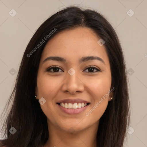 Joyful latino young-adult female with long  brown hair and brown eyes