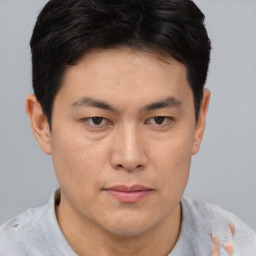 Neutral asian young-adult male with short  brown hair and brown eyes