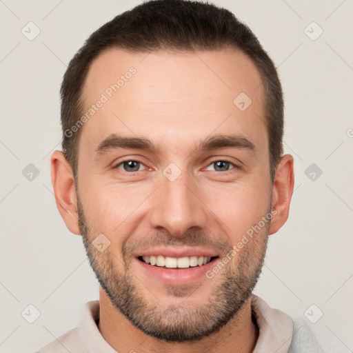 Joyful white young-adult male with short  brown hair and brown eyes